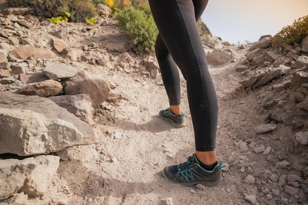 Closeup of a hiker's feet during a mountain hike love of nature concept