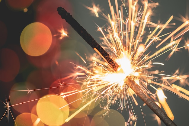 Closeup of holiday christmas sparkler on dark background