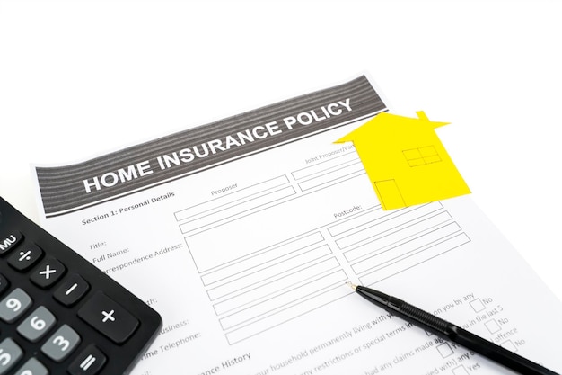 Closeup of home insurance policy concept in white