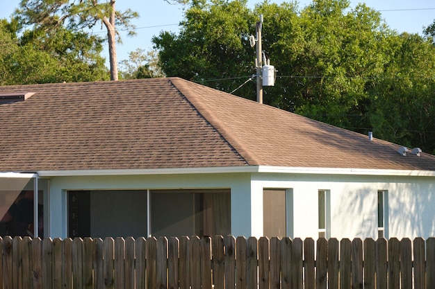 Closeup of house roof top covered with asphalt or bitumen shingles Waterproofing of new building