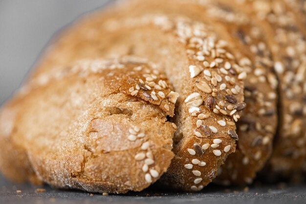 Closeup image of a bread cutting on a white background isolated dark background