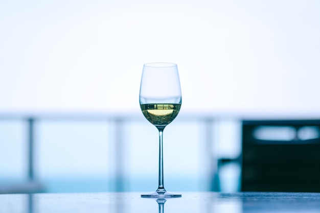 Closeup image of champagne in a wine glass with blurred background