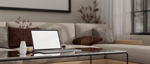 Closeup image of laptop mockup and decor on modern coffee table in cozy living room