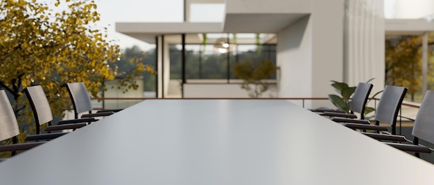 A closeup image of a modern meeting table on an outdoor terrace