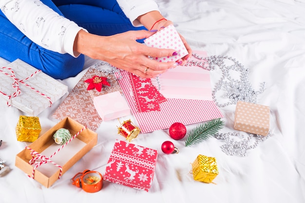 Closeup image of mother making Christmas present