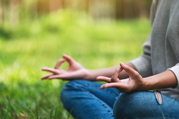 Closeup image of a woman meditating in nature