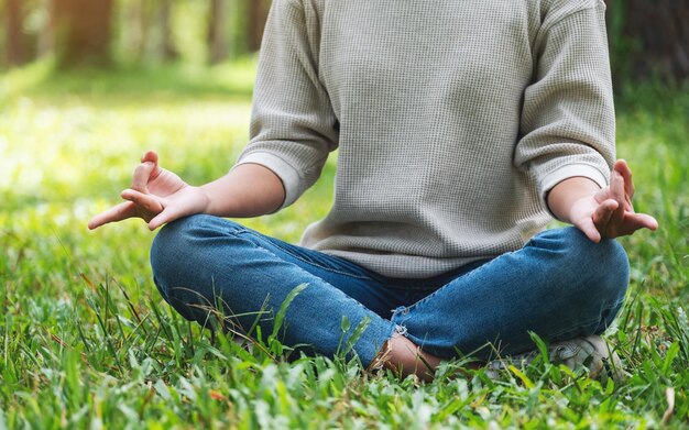 Closeup image of a woman meditating in nature