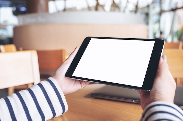 Closeup image of a woman using tablet