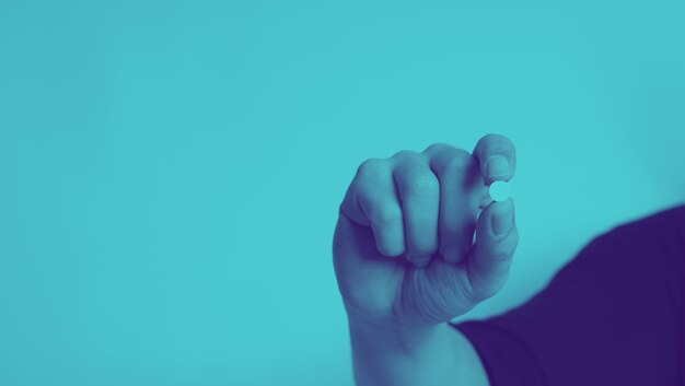 Closeup images of people holding a medicine pill in hand