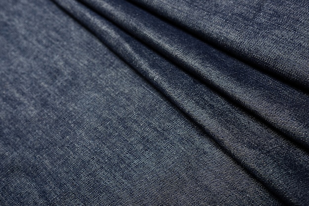 Closeup indigo denim stof textuur, materiaal voor jeans en ander kledingstuk.