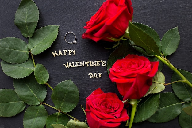 Closeup inscription Happy Valentine on a black background