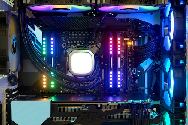 Closeup and inside high performance Desktop PC with multicolored neon light show status on working