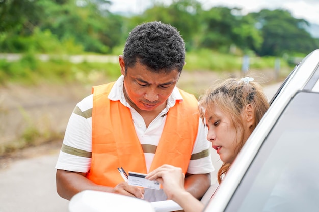 Closeup the insurance company officers write an accident report for customer claim