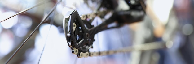 Closeup of iron chains on rear wheel of bicycle repair and maintenance of bicycles concept