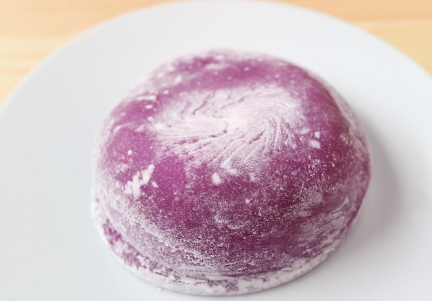 Closeup of Japanese Purple Sweet Potato Daifuku with Red Bean Paste Filling