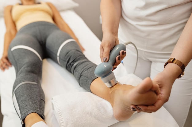 Closeup of joint sprain electrotherapy at medical clinic