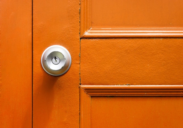 Closeup of knob with yellow door in vintage.