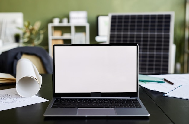 Closeup of laptop with empty display on table of business person at office