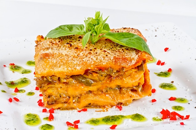 Closeup of lasagna and basil fork