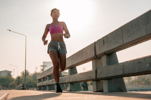 Closeup of legsAsian women jogging in morning workout at the city A city that lives healthy