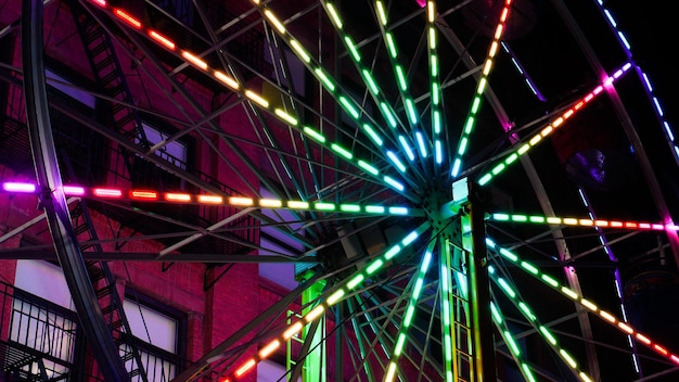Closeup of lights on a Ferris wheel at night