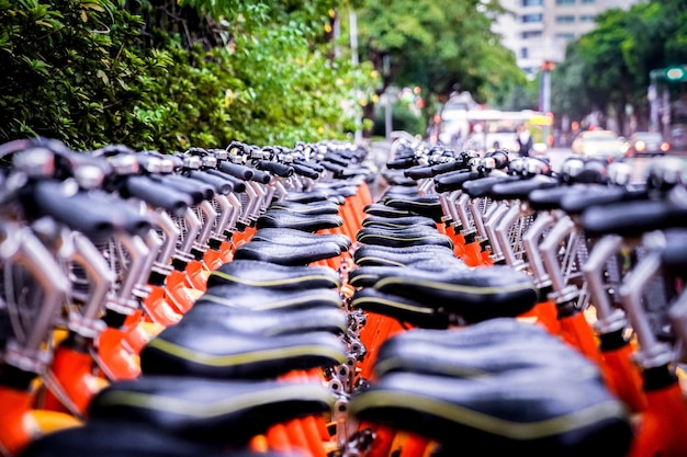 Closeup a lot of bicycles seats group parking for rental Taipei Taiwan