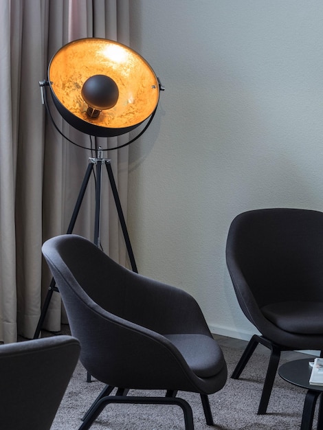 Closeup of a lounge chair with elegant lighting inside a room