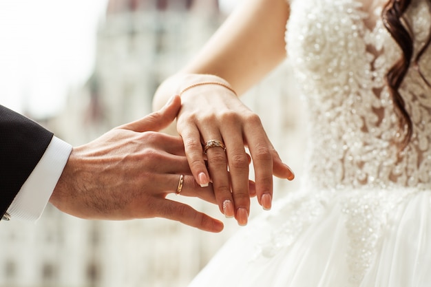 Closeup of loving couple holding hands. 