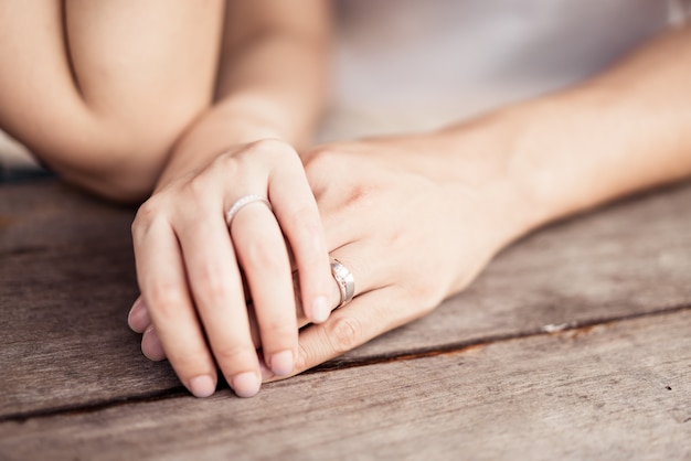 Closeup of loving couple holding hands