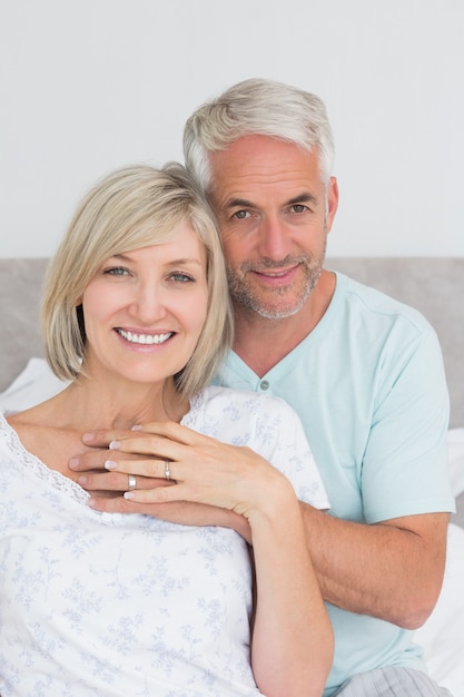 Closeup of a loving mature couple in bed