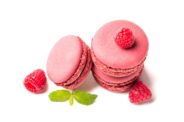 Closeup of macaroons with raspberries and mint