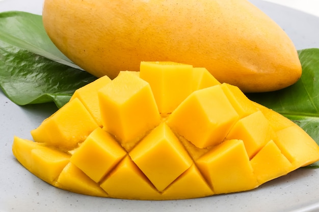 Closeup macro shot of carve beautiful yellow mango with sticky rice