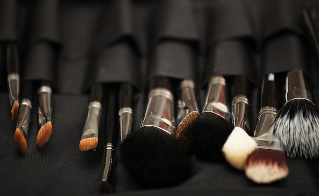 Closeup of makeup tools in their holder