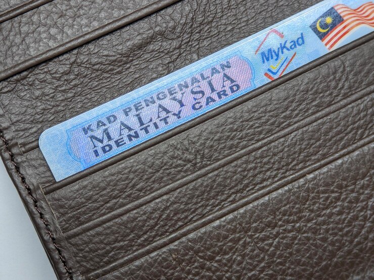 Photo closeup of malaysia identity card on brown wallet
