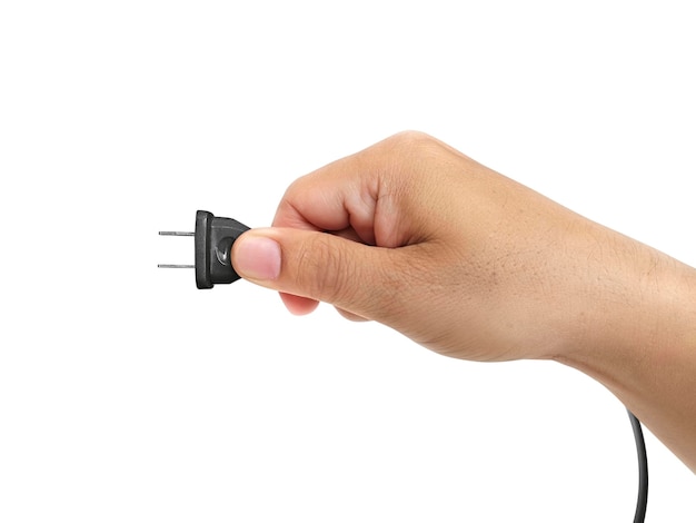 Closeup of male hand holding electric plug