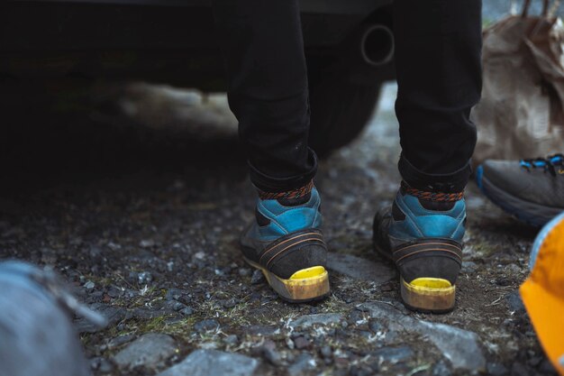 Closeup of a man changing into hiking shoes