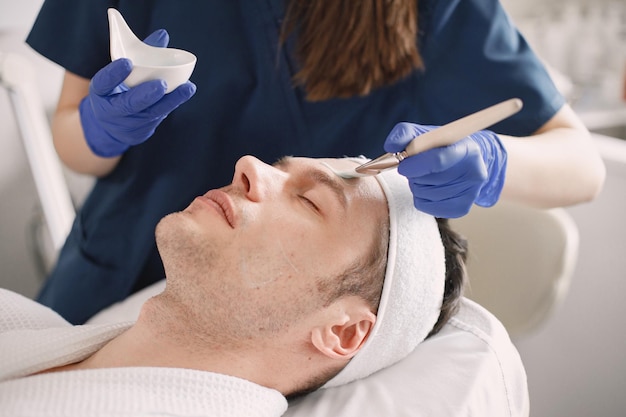 Closeup on a man in cosmetologist cabinet has a skincare procedure