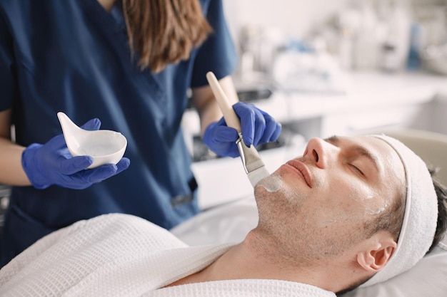 Closeup on a man in cosmetologist cabinet has a skincare procedure