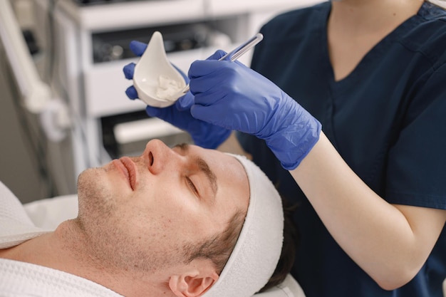 Closeup on a man in cosmetologist cabinet has a skincare procedure