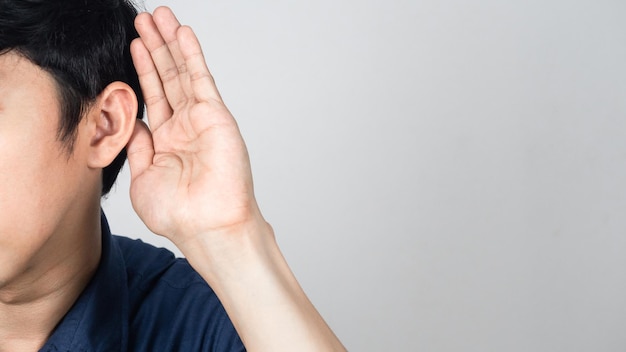 Closeup man gesture listening isolated studio shot