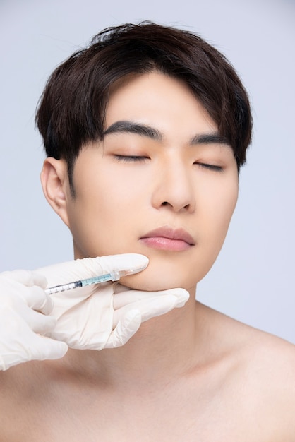 Closeup of man preparing for facial plastic surgery