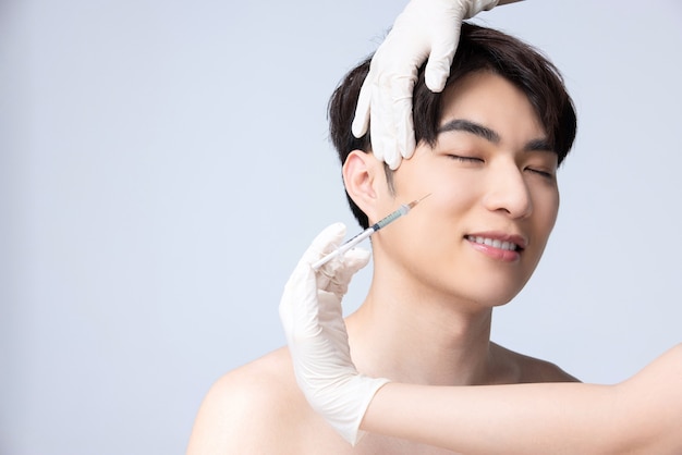 Closeup of man preparing for facial plastic surgery