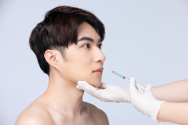 Closeup of man preparing for facial plastic surgery