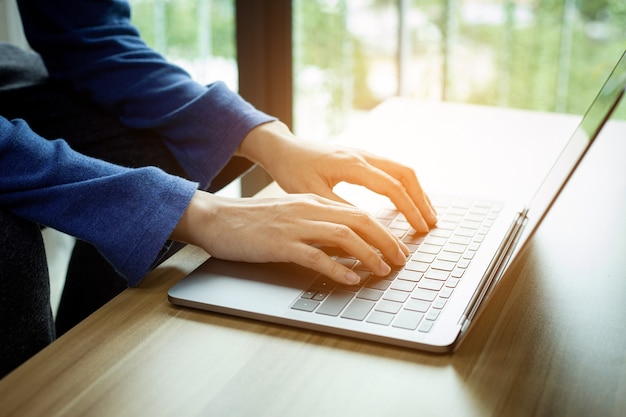 Closeup man typing  remotely at home