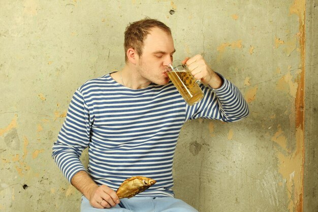 Closeup of a man with a glass of beer