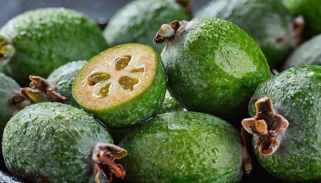 Closeup of many wet feijoas Selective focus