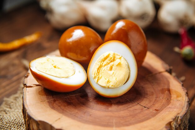 Closeup on marinated eggs on the wooden board