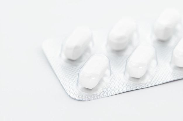 Closeup of medicine capsule and pills in blister pack