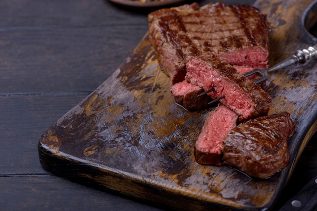 Closeup medium rare grilled steak