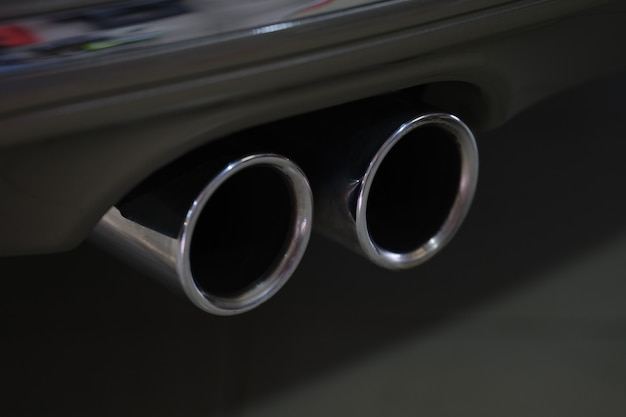 Closeup of metal exhaust pipe of sports car